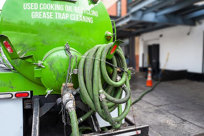 a pump truck emptying a grease trap in Calexico, CA